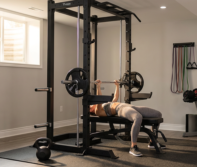 Woman working out with Vision Fitness equipment.